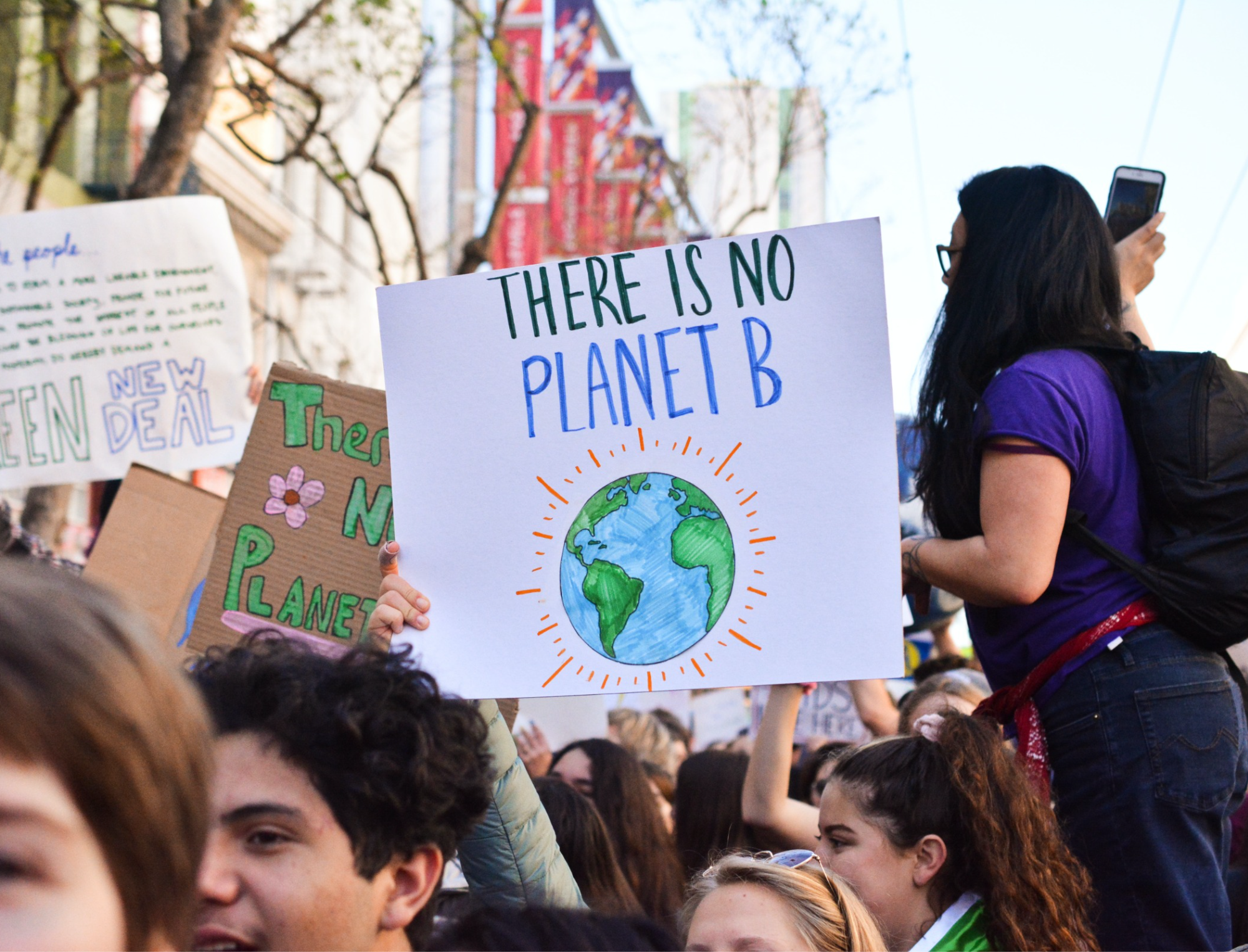 Protestors gather and one holds a sign that reads “There is no Planet B.” Learn about climate change and racism with Britt Hawthorne.