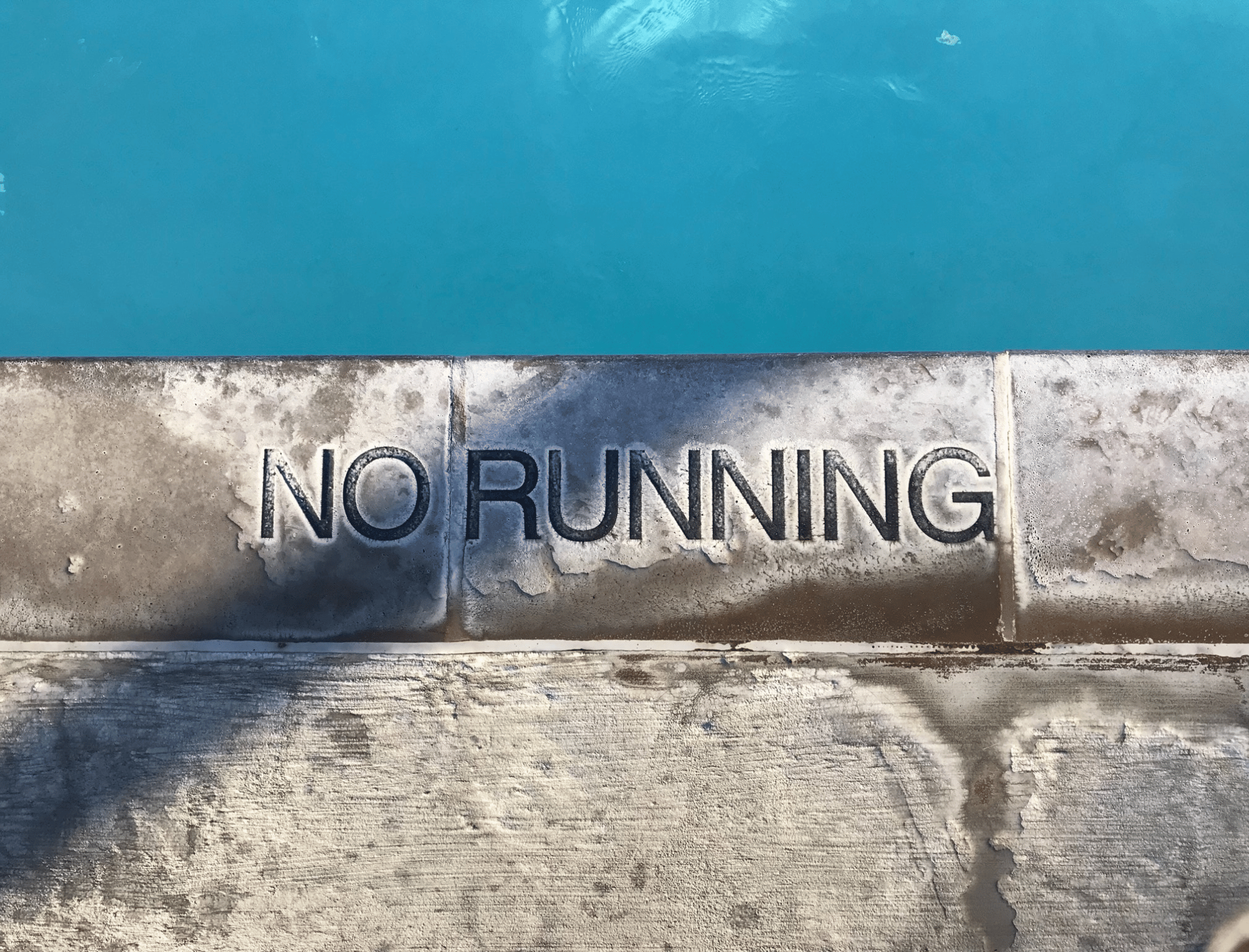 Sign that reads “no running". Unlearn ableist language with Britt Hawthorne. Photo: Ruel Abadam